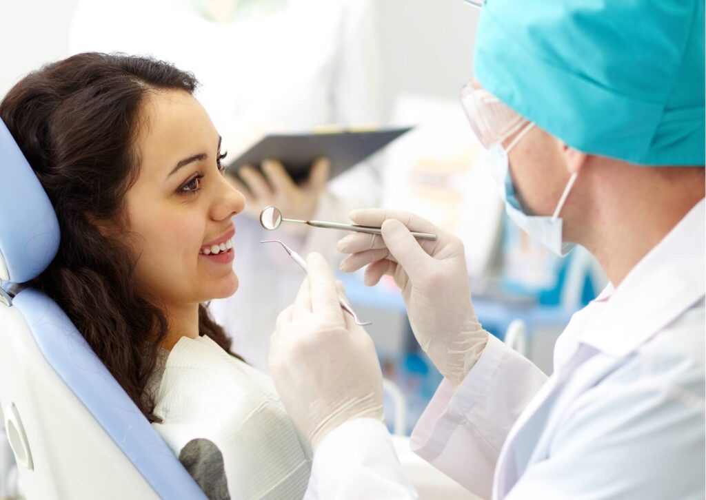 Dentist discussing veneer treatment options during a consultation to help a patient understand veneer costs and the treatment process.