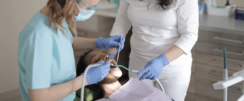 dental professionals working on a patient